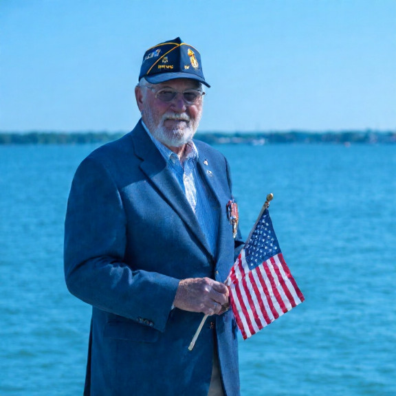 retired veteran clarence "sarge" throckmorton in vfw cap standing on lake erie dock holding american flag